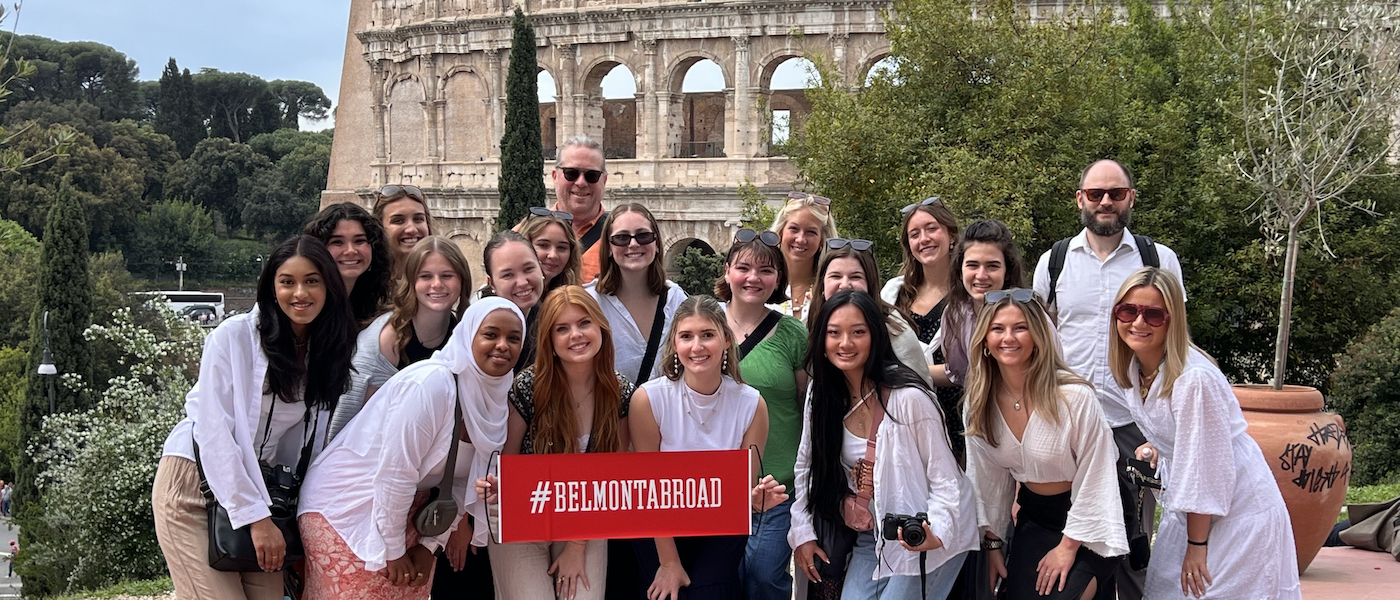 Belmont students stand posed outside the Colosseum in Rome