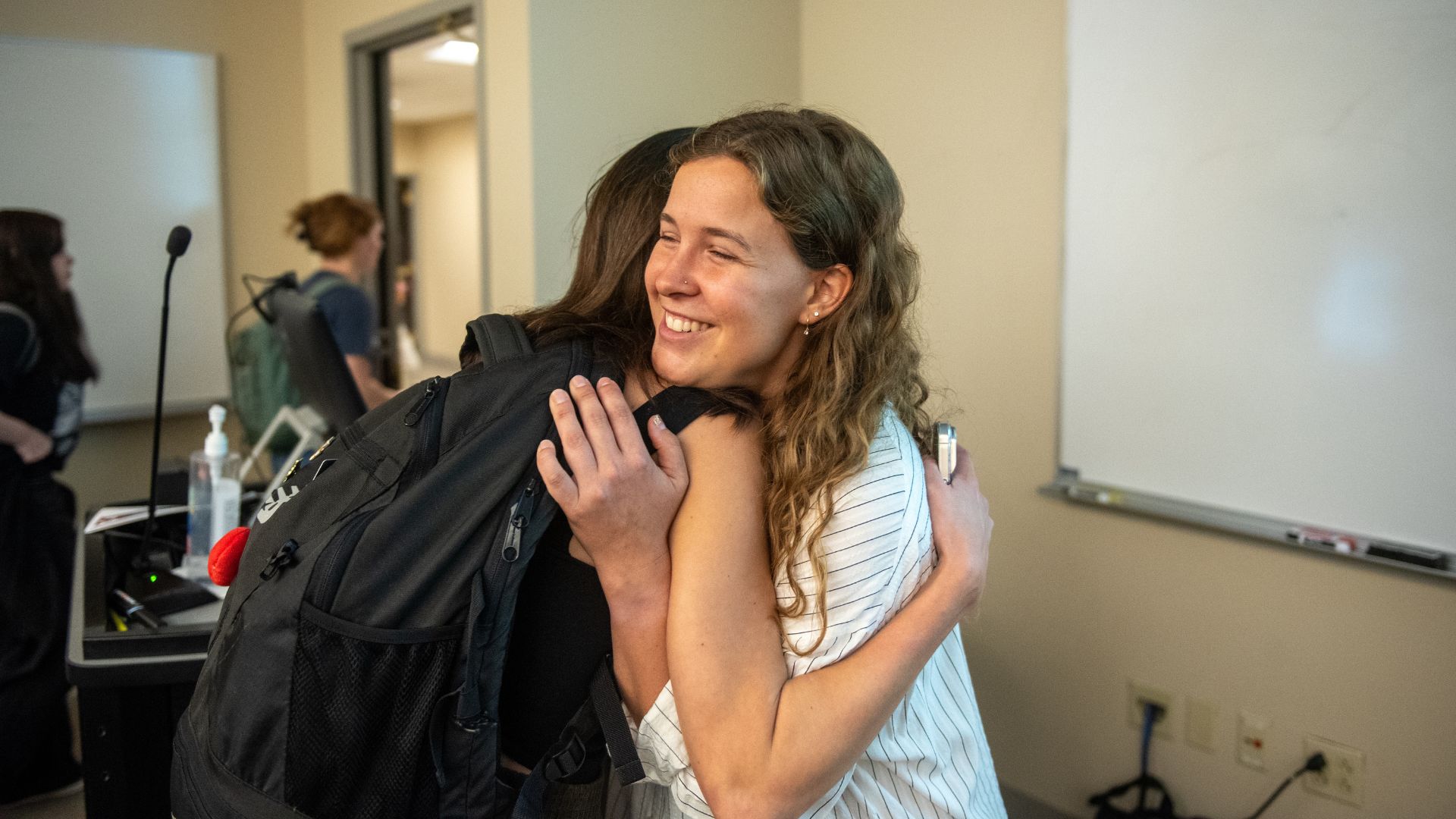 Yordy hugs a friend after her presentation