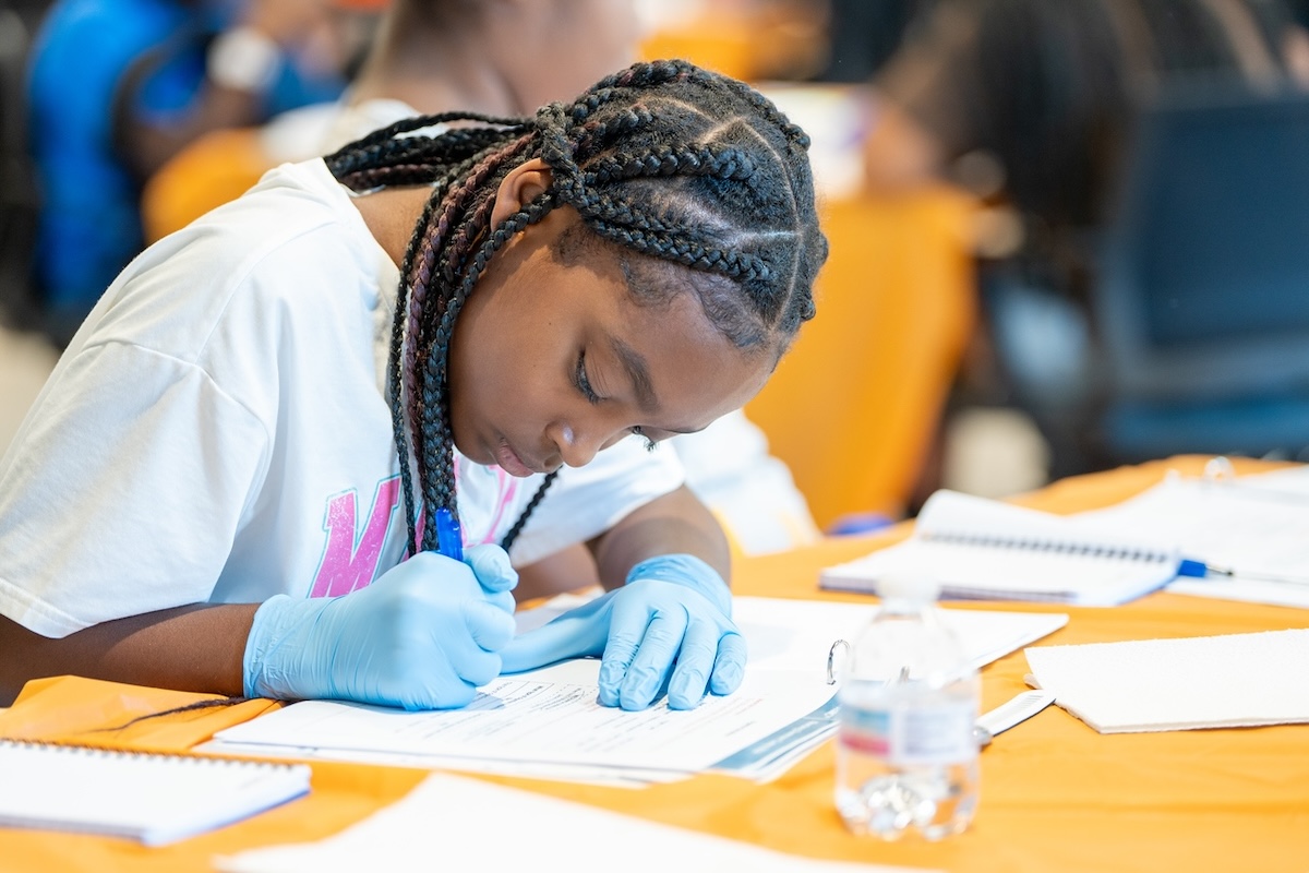 Student working at the camp