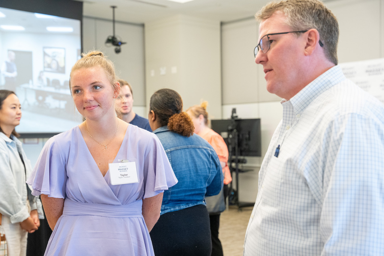 Female and male reunion attendees talking