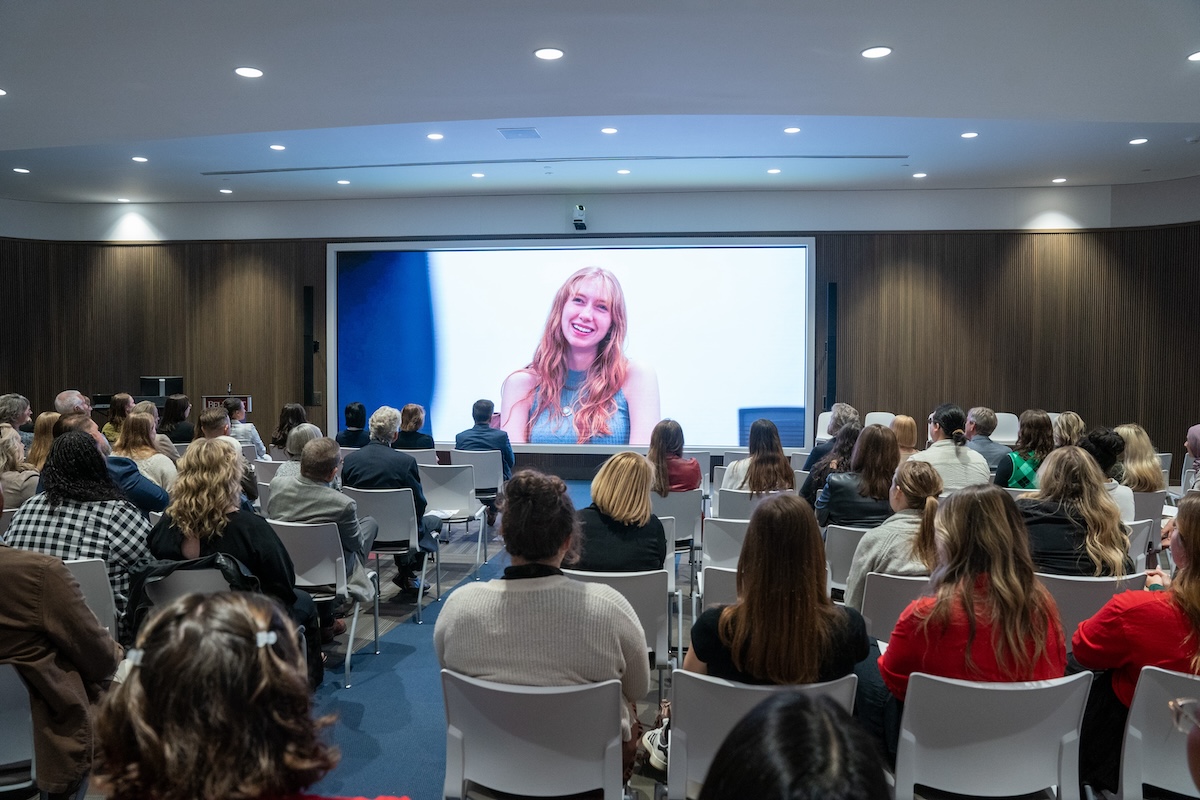 Guests watch a video at the Social Work 50th Celebration