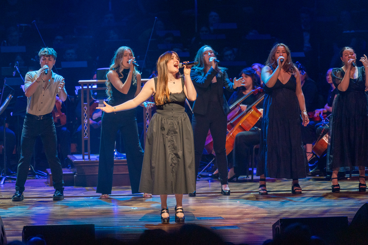 student singing on stage