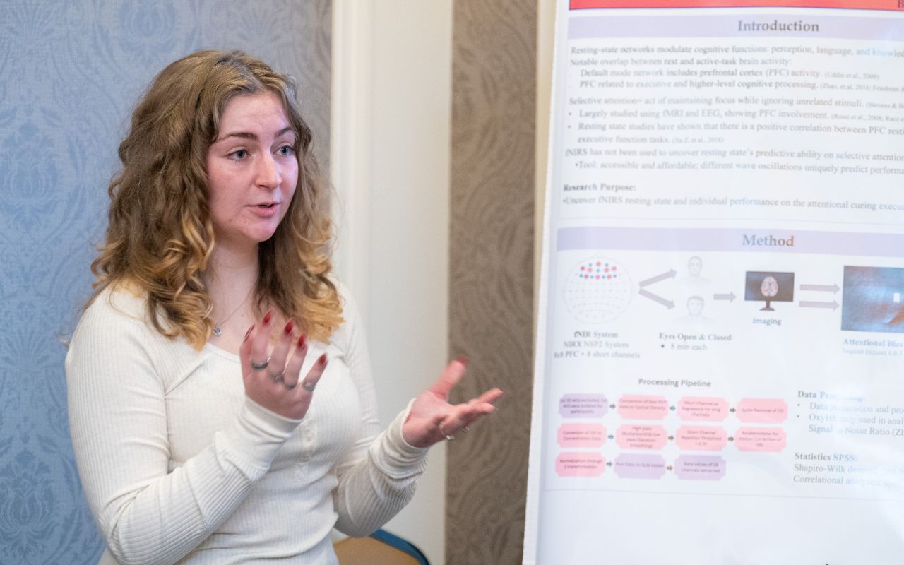 A student with her poster