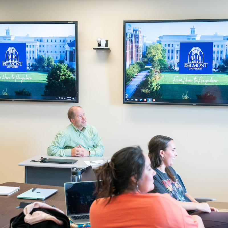 Professor and students in business class