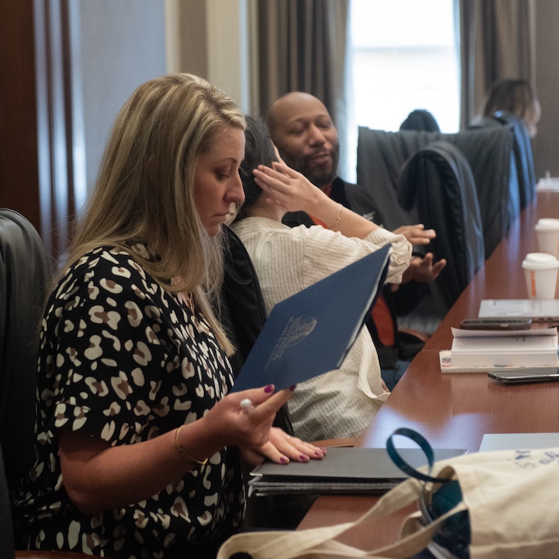 Student of educational leadership master’s program at a board table