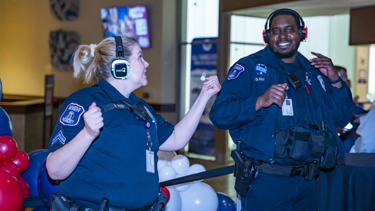 two Belmont security officers dancing at a silent disco