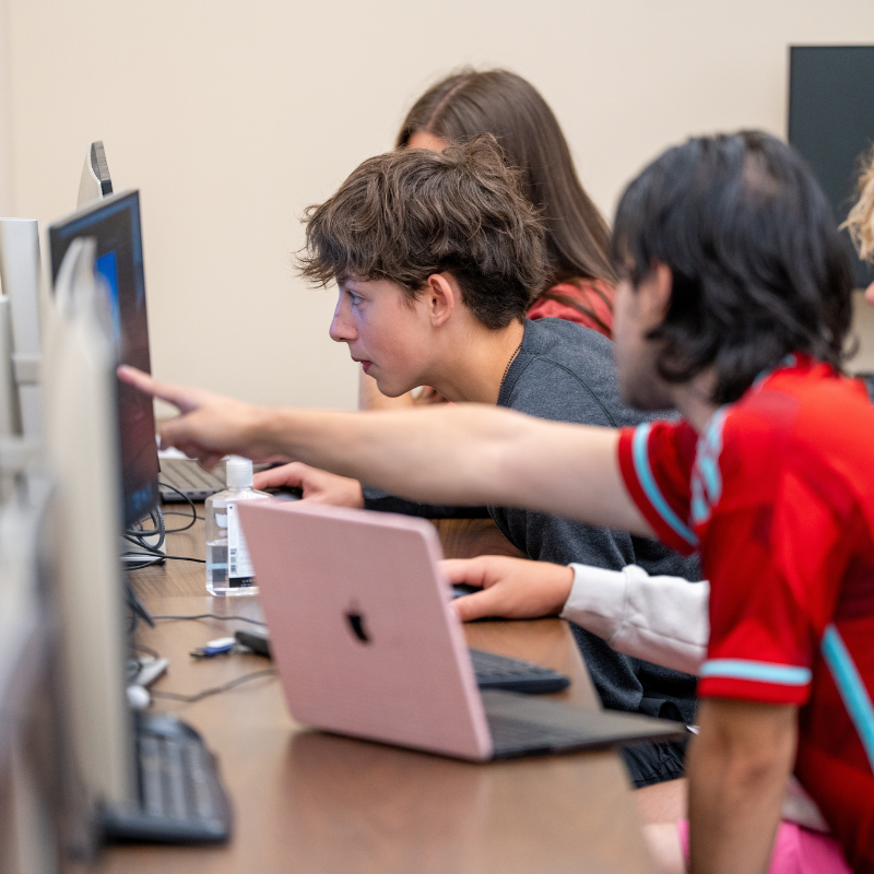 Student at a computer at camp