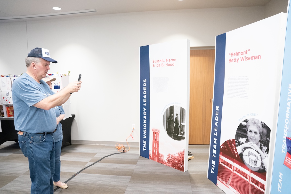 dr jones scans a QR code with his phone within the exhibit