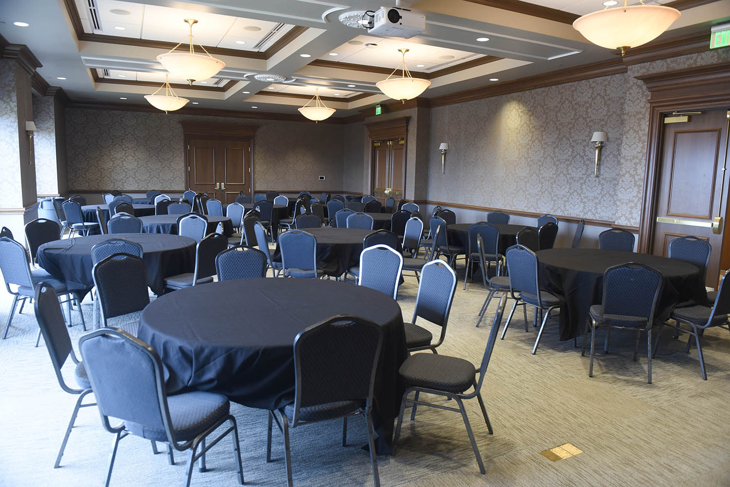 Massey Boardroom with empty round tables and chairs