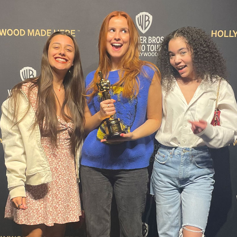 three females at an awards ceremony