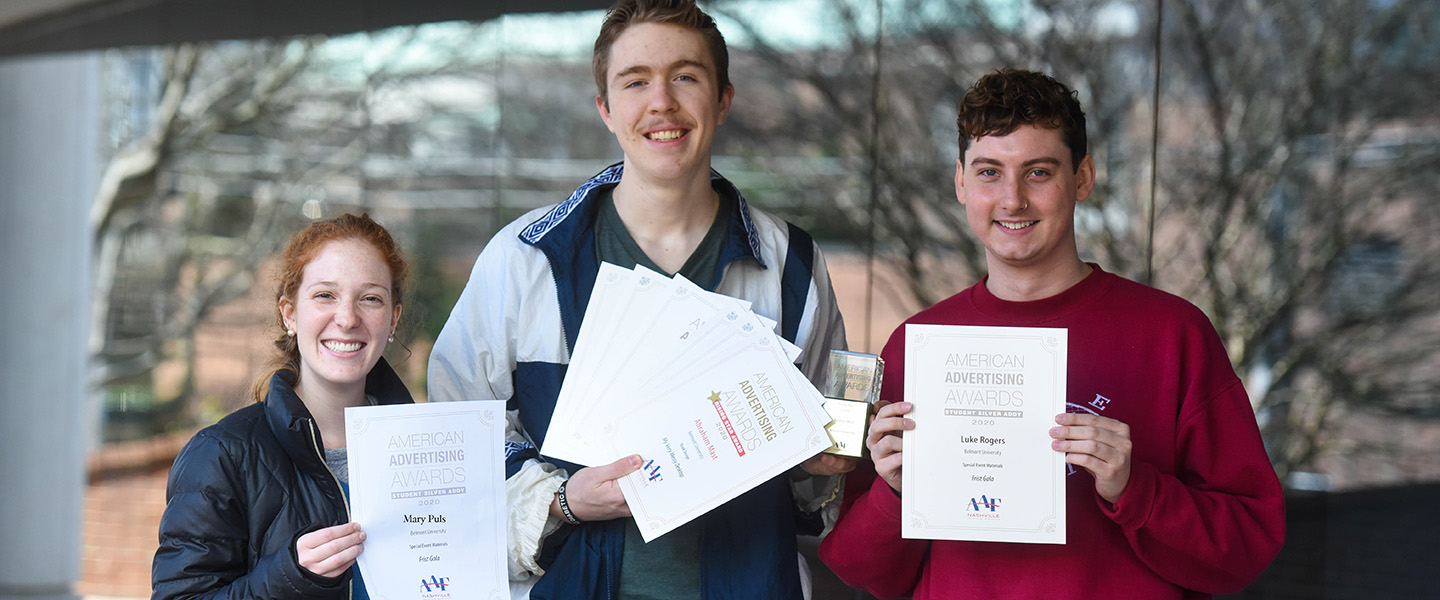 Students holding their awards